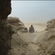 Obi wan sitting in the desert.